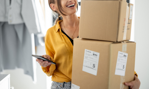 Woman carrying delivered packages